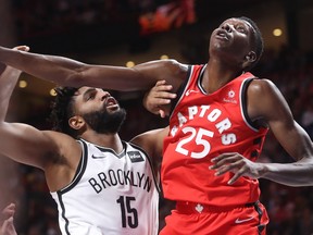 Toronto Raptors forward Chris Boucher blocks Brooklyn Nets forward Alan Williams during second-half NBA pre-season game in Montreal on Wednesday, Oct. 10, 2018.