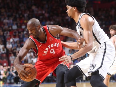 Toronto Raptors forward Serge Ibaka tries to get away from Brooklyn Nets centre Jarrett Allen during first-half NBA pre-season game in Montreal on Wednesday, Oct. 10, 2018.