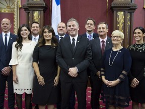 Parti Quebecois interim Leader Pascal Bérubé poses with members of his caucus after they were sworn in during a ceremony at the National Assembly Friday, October 19, 2018 at the legislature in Quebec City. From the left, Joel Arseneau, Catherine Fournier, Martin Ouellet, Véronique Hivon, Harold Lebel, Pascal Berube, Sylvain Gaudreault, Sylvain Roy, Lorraine Richard, Megan Perry Mélançon.