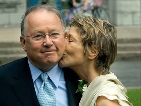 An elated Bernard Landry receives a kiss from his new bride, Chantal Renaud, following their civil ceremony in Vercheres in June 2004.