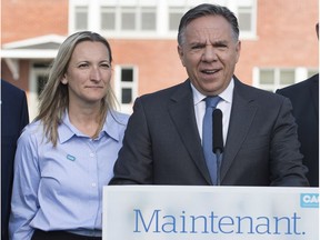 CAQ's François Legault and Marilyne Picard (Soulanges) during a campaign stop in the Off-Island last month.