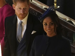 Britain's Prince Harry and Meghan, Duchess of Sussex attend the wedding of Princess Eugenie of York and Jack Brooksbank in St George's Chapel, Windsor Castle, near London, England, Friday Oct. 12, 2018.