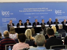 Intergovernmental Panel on Climate Change, IPCC, Chair Hoesung Lee, top center, and other leaders hold a press conference in Incheon, South Korea, Monday, Oct. 8, 2018. Preventing an extra single degree of heat could make a life-or-death difference in the next few decades for multitudes of people and ecosystems on this fast-warming planet, an international panel of scientists reported Sunday.