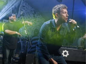 Damon Albarn, right, joined by De La Soul's Vincent Mason, performs at the 2014 SXSW Music Festival in Austin, Tex.