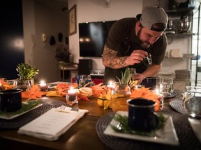 Chef Travis Petersen uses a dropper to add THC distillate to an amuse-bouche of toasted farro and young pine broth before guests arrive for a multi-course cannabis-infused meal in Vancouver, on Thursday October 11, 2018.