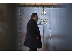 A security personnel stands at the entrance of Saudi Arabia's consulate in Istanbul, Saturday, Oct. 13, 2018. Turkish officials have an audio recording of the alleged killing of journalist Jamal Khashoggi from the Apple Watch he wore when he walked into the Saudi Consulate in Istanbul over a week ago, a pro-government Turkish newspaper reported Saturday.