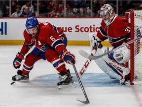 Montreal Canadiens defenceman Shea Weber and teammate goalie Carey Price eye the puck at the Bell Centre in Montreal on Jan. 9, 2017.
