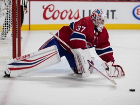Montreal Canadiens goaltender Antti Niemi reaches out to pull in the puck during against the Florida Panthers in Montreal on Sept. 19, 2018.
