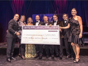 ONE BIG CHEQUE FOR A BEAUTIFUL CAUSE: Transat GM and board member Joe Adamo, Roasters Foundation executive director, and SMH Board of Governors 1st vice President, Rachel Renaud, SMHF president/CEO Cynda Heward, ball president, Bombardier CEO Alain Bellemare, Governors Board past president and Dentons Canada partner Terry Didus, SMHF board president and Subway Québec president Guy Laframboise, Ball committee chair, Kugler Kandestin managing partner Arthur Wechsler and SMHF board past president Anne-Marie Boucher proudly display this year's impressive magic number for the St. Mary's Ball.