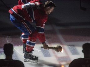 Canadiens captain Shea Weber lights flame during season opener at the Bell Centre in Montreal against the Los Angeles Kings on Oct. 11, 2018.