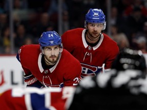 Montreal Canadiens centre Phillip Danault, left, and winger Tomas Tatar during action against the Detroit Red Wings in Montreal on Oct. 15, 2018.