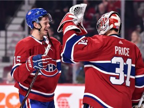 Jesperi Kotkaniemi of the Montreal Canadiens celebrates a victory with goaltender Carey Price against the Washington Capitals at the Bell Centre on Nov. 1, 2018, in Montreal.