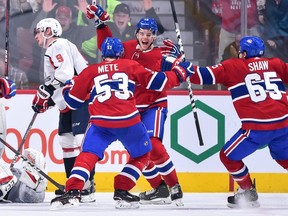 Canadiens' Jesperi Kotkaniemi (15) celebrates a third-period goal with teammates against the Washington Capitals at the Bell Centre on Thursday, Nov. 1, 2018, in Montreal.