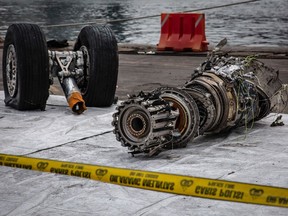 JAKARTA, INDONESIA - NOVEMBER 04: The wreckage of an engine and wheels from Lion Air Flight JT 610 recovered from the sea at the Tanjung Priok port on November 4, 2018 in Jakarta, Indonesia. Indonesian authorities said on Saturday that a diver who joined the search operation for Lion Air flight 610 had died after being found unconscious on Friday, possibly due to an accident while diving. All 189 passengers and crew for the Boeing 737 plane are feared dead as rescuers as investigators and agencies from around the world continue its week-long search for victims and the cockpit voice recorder which might solve the mystery to the deadly crash into the Java sea shortly after takeoff.