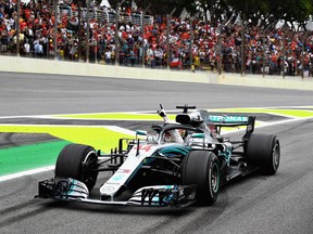 Race winner Lewis Hamilton of Great Britain driving the (44) Mercedes AMG Petronas F1 Team Mercedes WO9 celebrates during the Formula One Grand Prix of Brazil at Autodromo Jose Carlos Pace on Sunday, Nov. 11, 2018, in Sao Paulo, Brazil.