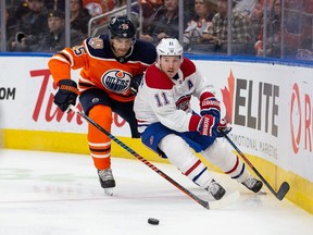 Darnell Nurse of the Edmonton Oilers pursues Brendan Gallagher of the Montreal Canadiens during the third period at Rogers Place on Nov. 13, 2018, in Edmonton.