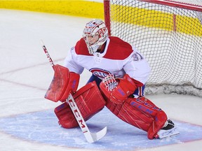 Canadiens goalie Carey Price gets ready for shot during pregame warmup before NHL game against the Calgary Flames at Scotiabank Saddledome on Nov. 15, 2018.