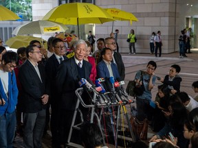 HONG KONG, HONG KONG - NOVEMBER 19:  Occupy co-founder Reverend Chu Yiu-ming speaks to members of media after the first day of court hearing at West Kowloon Court on November 19, 2018 in Hong Kong. Nine pro-democracy activists from the 2014 Umbrella movement in Hong Kong pleaded not guilty on Monday after facing charges related to "public nuisance" which paralyzed parts of the city for months. Law professor Benny Tai, sociologist professor Chan Kin-man, and retired pastor Chu Yiu-ming, face charges of conspiracy to cause public nuisance, inciting others to cause public nuisance, and inciting people to incite others to cause public nuisance, with each charge carrying a maximum jail term of seven years.