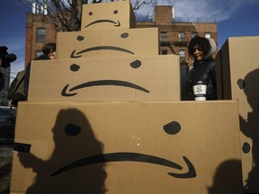 NEW YORK, NY  - NOVEMBER 14: Boxes with the Amazon logo turned into a frown face are stacked up after a protest against Amazon in the Long Island City neighborhood of the Queens borough on November 14, 2018 in New York City. Amazon announced on Tuesday that it has chosen Arlington, Virginia and Long Island City as the two new locations which will serve as additional headquarters for the company. Amazon says each location will create 25,000 jobs.