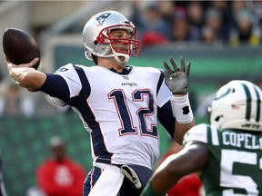 Tom Brady #12 of the New England Patriots looks to pass during the first quarter against the New York Jets at MetLife Stadium on November 25, 2018 in East Rutherford, New Jersey.