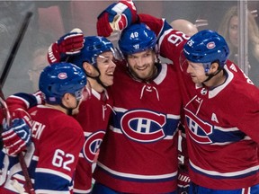 Montreal Canadiens center Jesperi Kotkaniemi (15) is congratulated by teammates Artturi Lehkonen (62), Joel Armia (40) and Jeff Petry (26) after scoring his first NHL goal against Washington Capitals goaltender Braden Holtby (70) during 1st period NHL action at the Bell Centre in Montreal, on Thursday, November 1, 2018. Dave Sidaway /Montreal Gazette