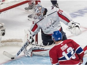 Washington Capitals goaltender Braden Holtby stops Montreal Canadiens left wing Max Domi on the goal line during third period at the Bell Centre in Montreal on Nov. 1, 2018.