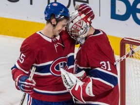 Canadiens centre Jesperi Kotkaniemi and goalie Carey Price share a moment after Montreal's last-minute victory over the Stanley Cup-champion Capitals Thursday night at the Bell Centre.