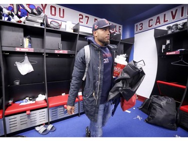 Kicker Boris Bede carries some things out of the locker room as Alouettes players cleaned out their lockers at the Olympic Stadium in Montreal on Sunday, Nov. 4, 2018.