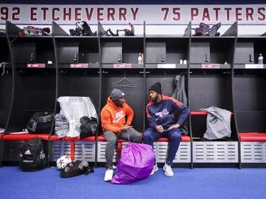 Alouettes' Stefan Logan, left, and Jermaine Robinson chat after cleaning out their lockers at the Olympic Stadium in Montreal on Sunday, Nov. 4, 2018.