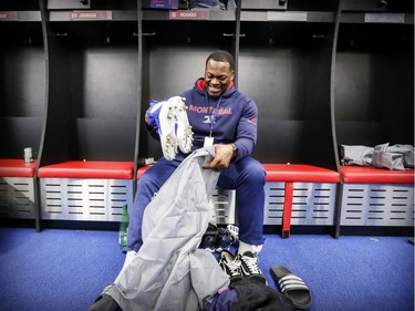 Alouettes' Henoc Muamba puts cleats in a bag as players cleaned out their lockers at the Olympic Stadium in Montreal on Sunday, Nov. 4, 2018.