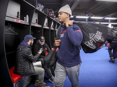 Quarterback Antonio Pipkin slings a bag over his shoulder on his way out of the locker room as Alouettes players cleaned out their lockers at the Olympic Stadium in Montreal on Sunday, Nov. 4, 2018.