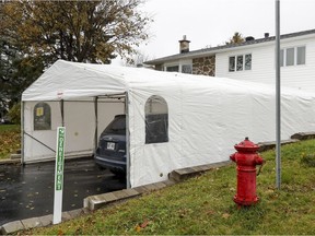 House with a temporary car shelter in Pierrefonds.