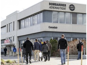 Workers return from lunch to the Bombardier plant on Marcel-Laurin Blvd. in Montreal Nov. 8, 2018.
