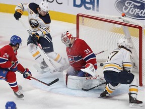 MONTREAL, QUE.: NOVEMBER  8, 2018 -- Buffalo Sabres' Vladimir Sobotka (17) scores on Montreal Canadiens goaltender Carey Price with teammate Nathan Beaulieu (82) and Phillip Danault (24) also on the play, during first period NHL action in Montreal on Thursday November 8, 2018. (Pierre Obendrauf / MONTREAL GAZETTE) ORG XMIT: 61686 - 9082