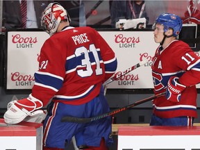 Canadiens' Brendan Gallagher gives goalie Carey Price a supportive pat after the goalie allowed six goals in a loss to the Sabres Thursday night at the Bell Centre.