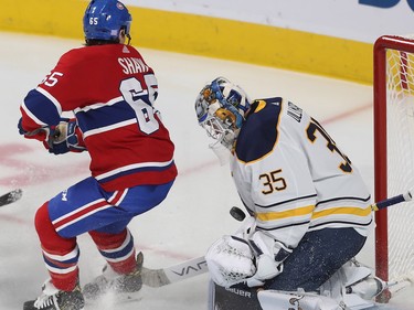 Andrew Shaw looks back at play on stop  by Buffalo Sabres goaltender Linus Ullmark during second period in Montreal on Thursday, Nov. 8, 2018.