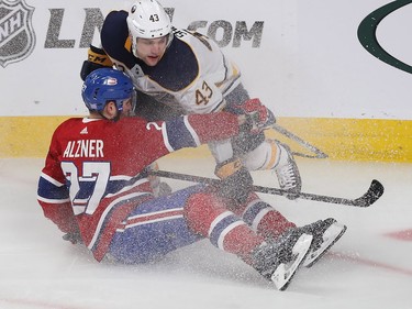 Karl Alzner is brought down by Buffalo Sabres left wing Conor Sheary during first period in Montreal on Thursday, Nov. 8, 2018.