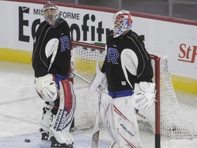 Laval Rocket goaltenders Charlie Lindgren, left, and Michael McNiven during practice on Nov. 12, 2018.