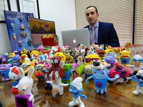 Joey Zukran, the lawyer who filed the class-action suit against McDonald's, with some of the toys that have been available to purchase from McDonald's since 2013.