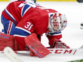 Canadiens goalie Carey Price slams his stick on the ice after giving up game-winning goal to the Washington Capitals' Lars Eller during overtime of NHL game at the Bell Centre in Montreal Nov. 19, 2018.