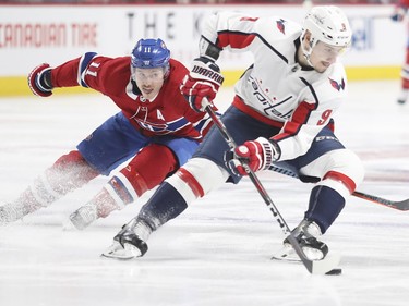 Brendan Gallagher, left, pursues Washington Capitals' Dmitry Orlov during first period at the Bell Centre on Monday, Nov. 19, 2018.