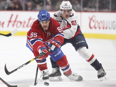 Andrew Shaw fights off check by Washington Capitals' Andre Burakovsky, rear, during first period at the Bell Centre on Monday, Nov. 19, 2018.