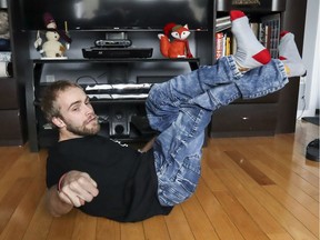 Michel Nadeau, who has cerebral palsy, performs breakdance moves at his Pincourt home.