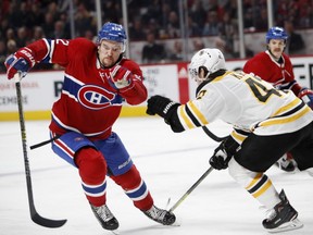 Montreal Canadiens' Jonathan Drouin outmanoeuvres Boston Bruins defenceman Torey Krug during NHL action in Montreal on Saturday November 24, 2018.