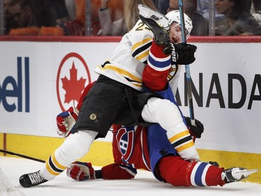 Boston Bruins' Jakob Forsbacka Karlsson lifts Canadiens' Jesperi Kotkaniemi and drops him to the ice then threw himself on to Kotkaniemi in Montreal on Saturday Nov. 24, 2018.