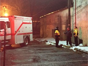 Pointe-Claire public safety workers tend to a broken water pipe at the closed Pioneer bar on Sunday, Nov. 25, 2018.