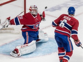 Canadiens defenceman Shea Weber watches as goalie Carey Price stretches to block a wide shot Tuesday night at the Bell Centre.