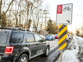 Traffic lines up on Cardinal Ave. near a bike path in Dorval.