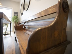 The church pew was found in the Eastern Townships and rests against the wall of the dining area.