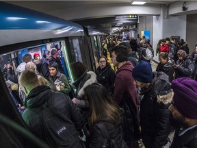 Montrealers politely line up to use the Orange Line at the Berri-UQÀM métro station in Montreal on Monday November 26, 2018.